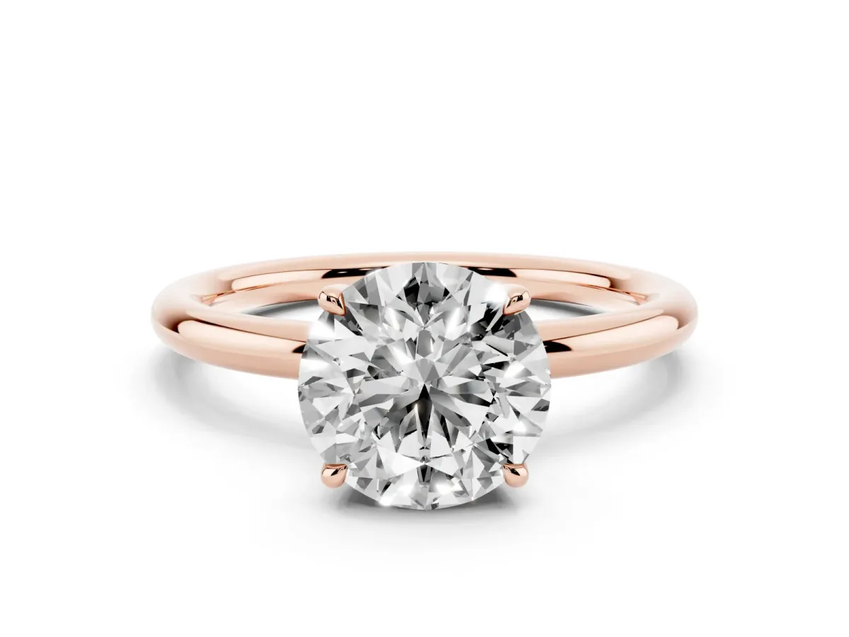 Round Cut Diamond Solitaire Ring with Thin Band and Four-Prong Setting Rose gold