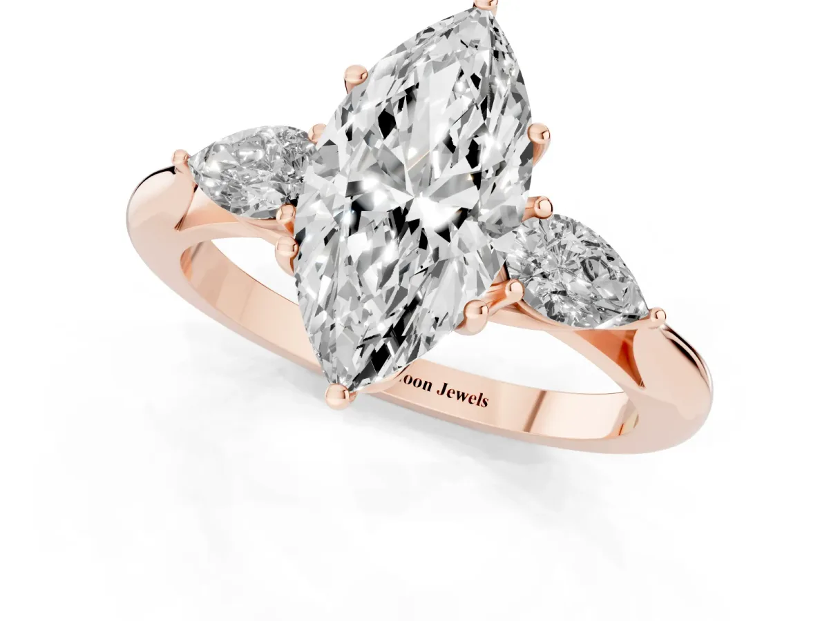 Marquise Cut Diamond Three-Stone Ring with Pear Side Stones and Prong Setting Rose gold