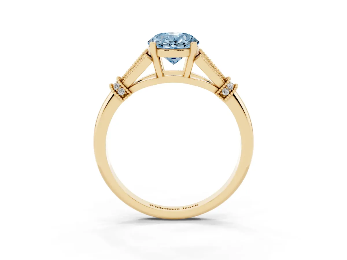 Fancy Blue Oval Cut Diamond Solitaire Ring with Floral Filigree and Pave Accents Yellow gold