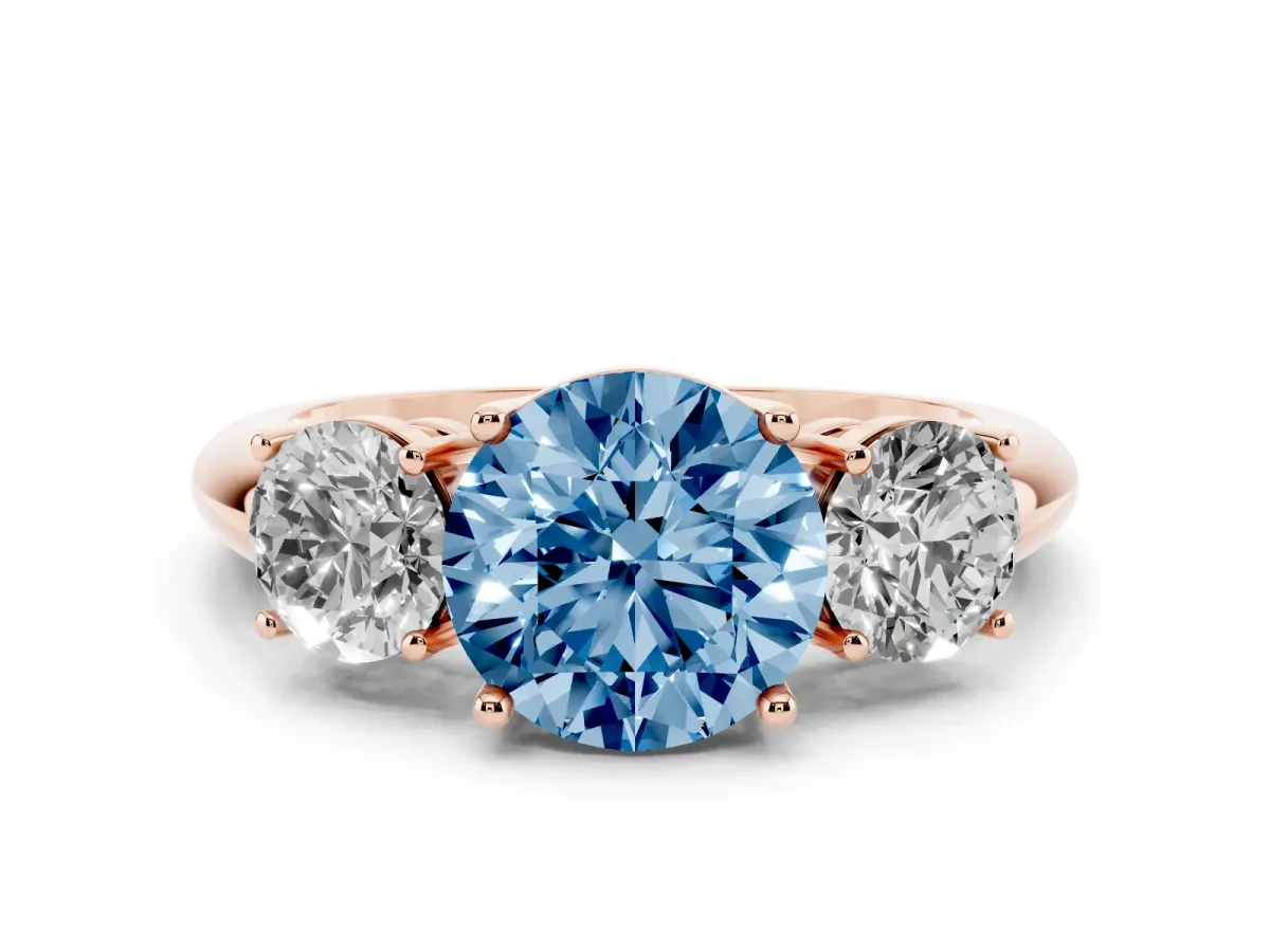 Fancy Blue Three-Stone Round Cut Cut Diamond Engagement Ring with Prong Setting on a White Gold Band Rose gold