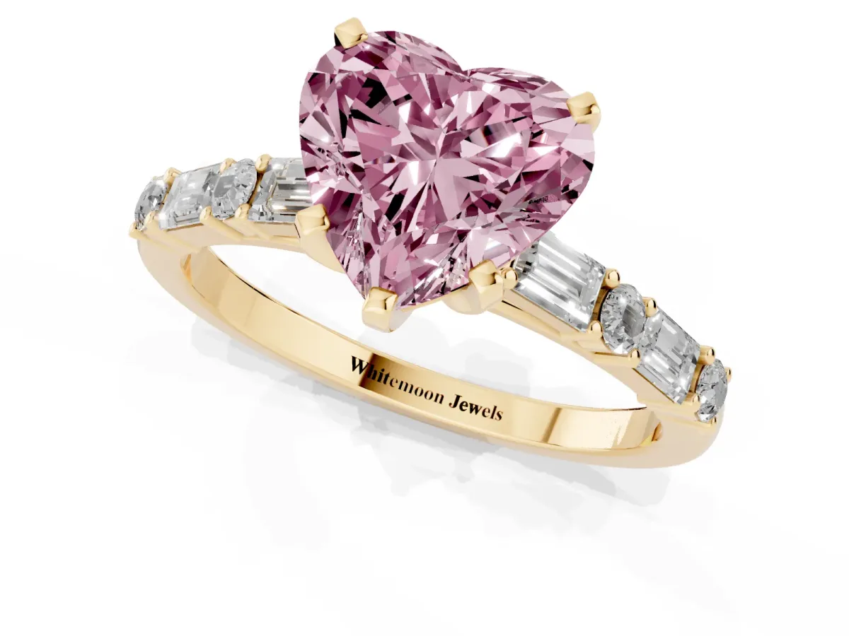 Fancy Pink Heart Cut Diamond Solitaire with Side Baguettes and Channel Set Band Yellow gold