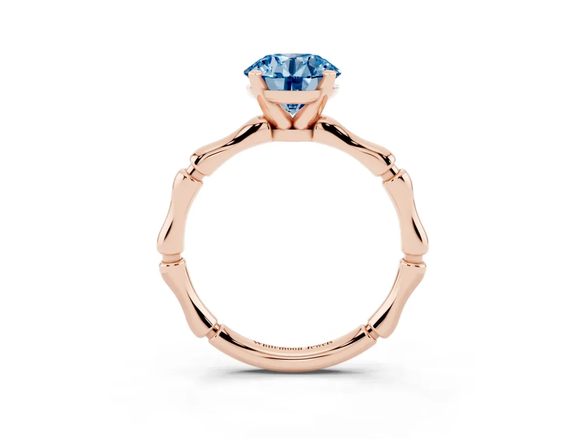 Fancy Blue Round Cut Solitaire Diamond Ring with Bamboo Band and Four-Prong Setting Rose gold