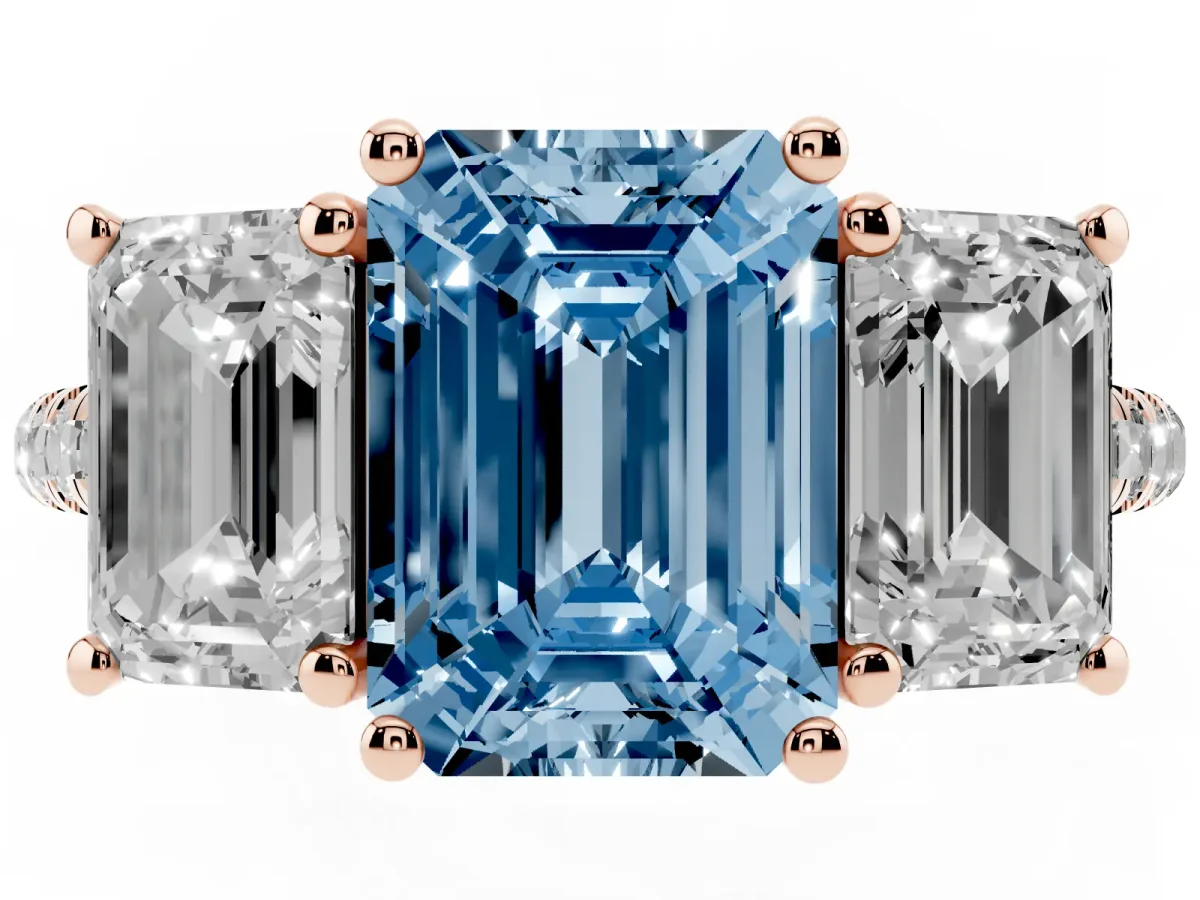 Fancy Blue Three-Stone Emerald Cut Diamond Ring with Round Pavé Band and Prong Setting Rose gold