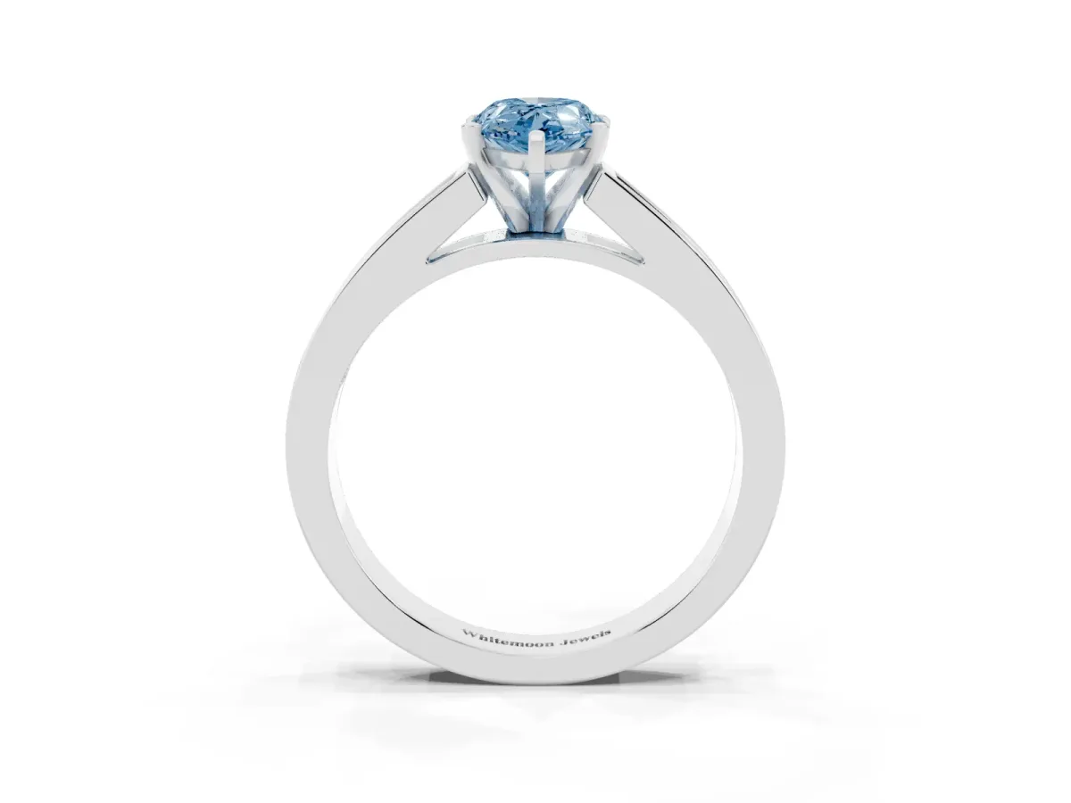 Fancy Blue Pear Cut Solitaire Diamond Ring with Channel-Set Band and Four-Prong Setting Silver