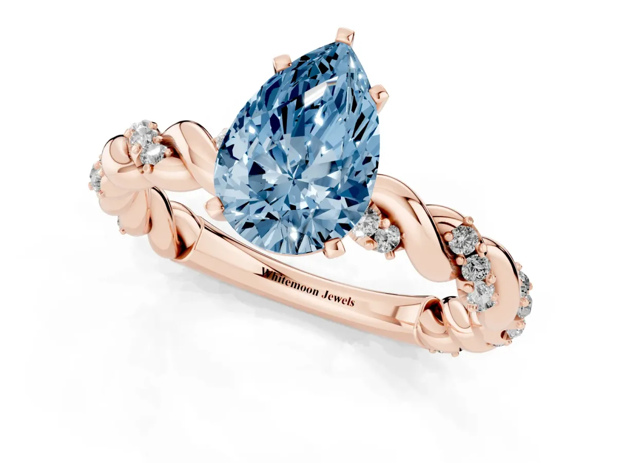 Fancy Blue Pear Cut Diamond Solitaire Ring with Twisted Band and Pavé Accents Rose gold