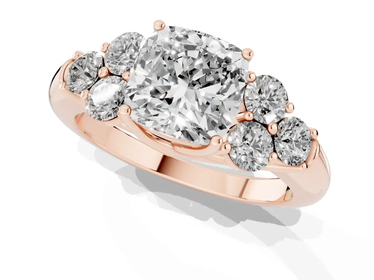 Cushion Cut Cut Diamond Cluster Ring with Round Accent Stones and Prong Setting on a Classic Band Rose gold