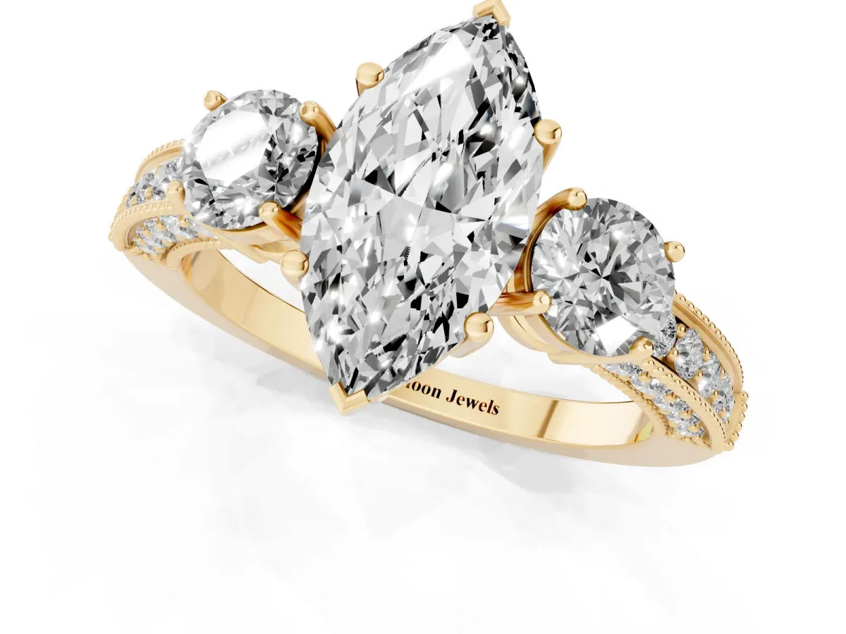 Marquise Cut Three-Stone Diamond Ring with Pavé Band and Four-Prong Setting Yellow gold