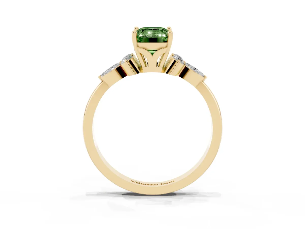 Fancy Green Emerald Cut Brilliant Diamond Solitaire Ring with Pear Side Stones and Four-Prong Setting Yellow gold
