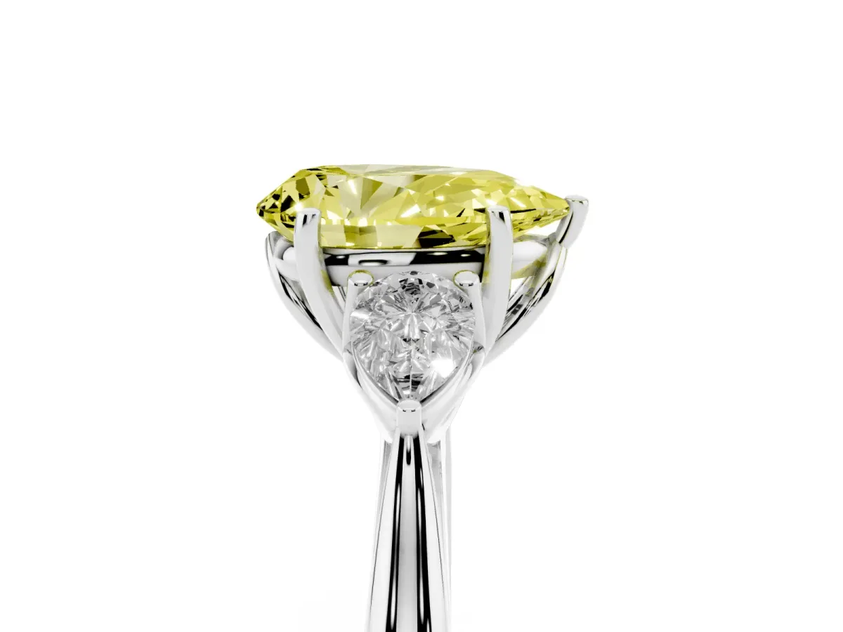 Fancy Yellow Three-Stone Pear Cut Brilliant Diamond Solitaire Ring with Tapered Band and Four-Prong Setting Platinum