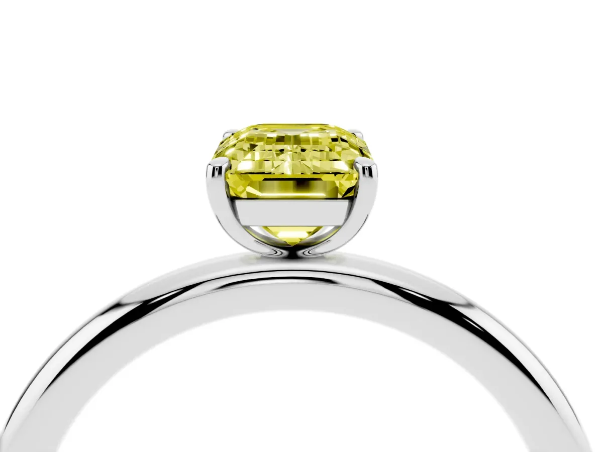 Fancy Yellow Emerald Cut Solitaire Diamond Ring with Four-Prong Setting on a Plain Band Platinum