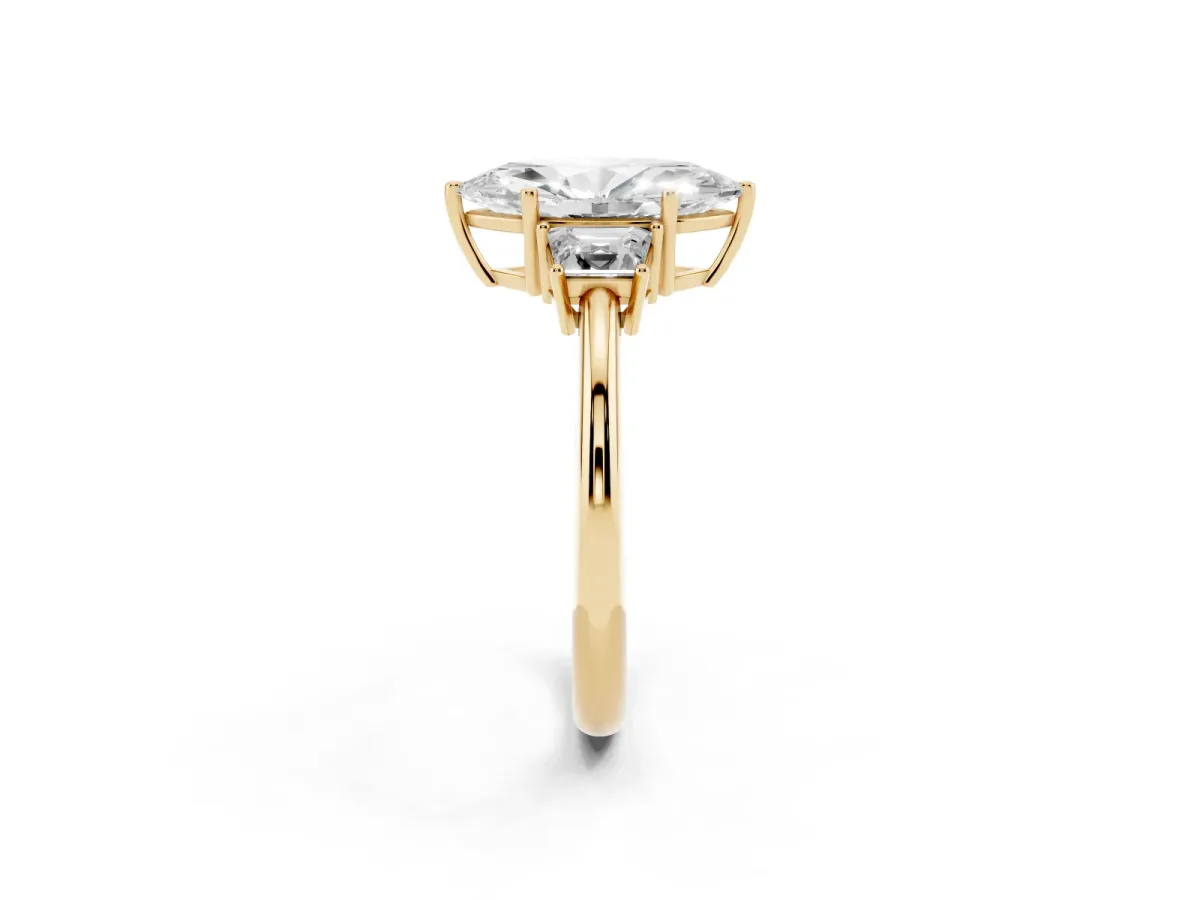 Marquise Cut Diamond Three-Stone Ring with Trapezoid Side Stones and Prong Setting Yellow gold