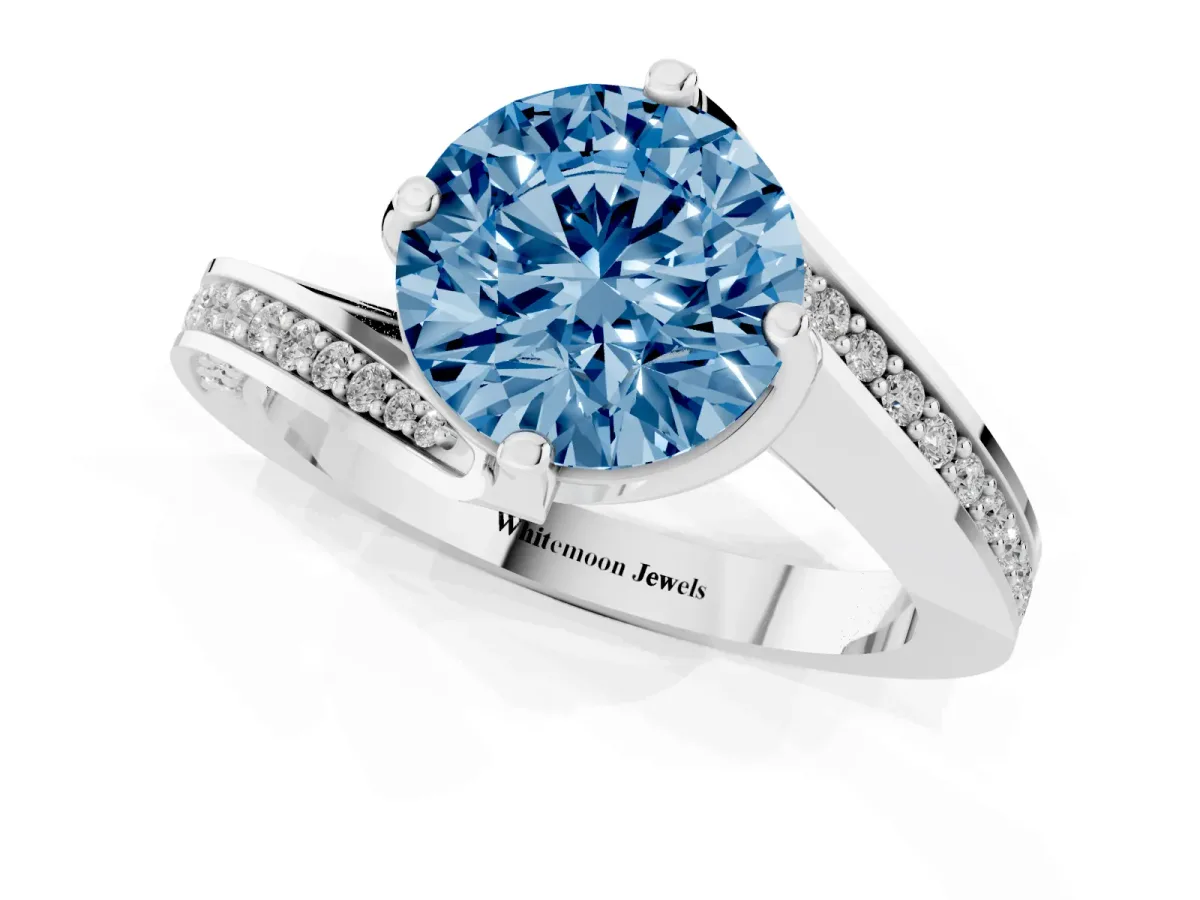 Fancy Blue Round Cut Solitaire Diamond Twist Band with Pavé Setting and Four-Prong Setting Silver