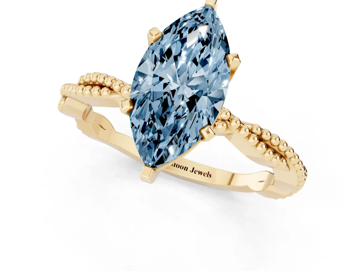 Fancy Blue Marquise Cut Solitaire Twisted Band with Bead Prong Setting Yellow gold