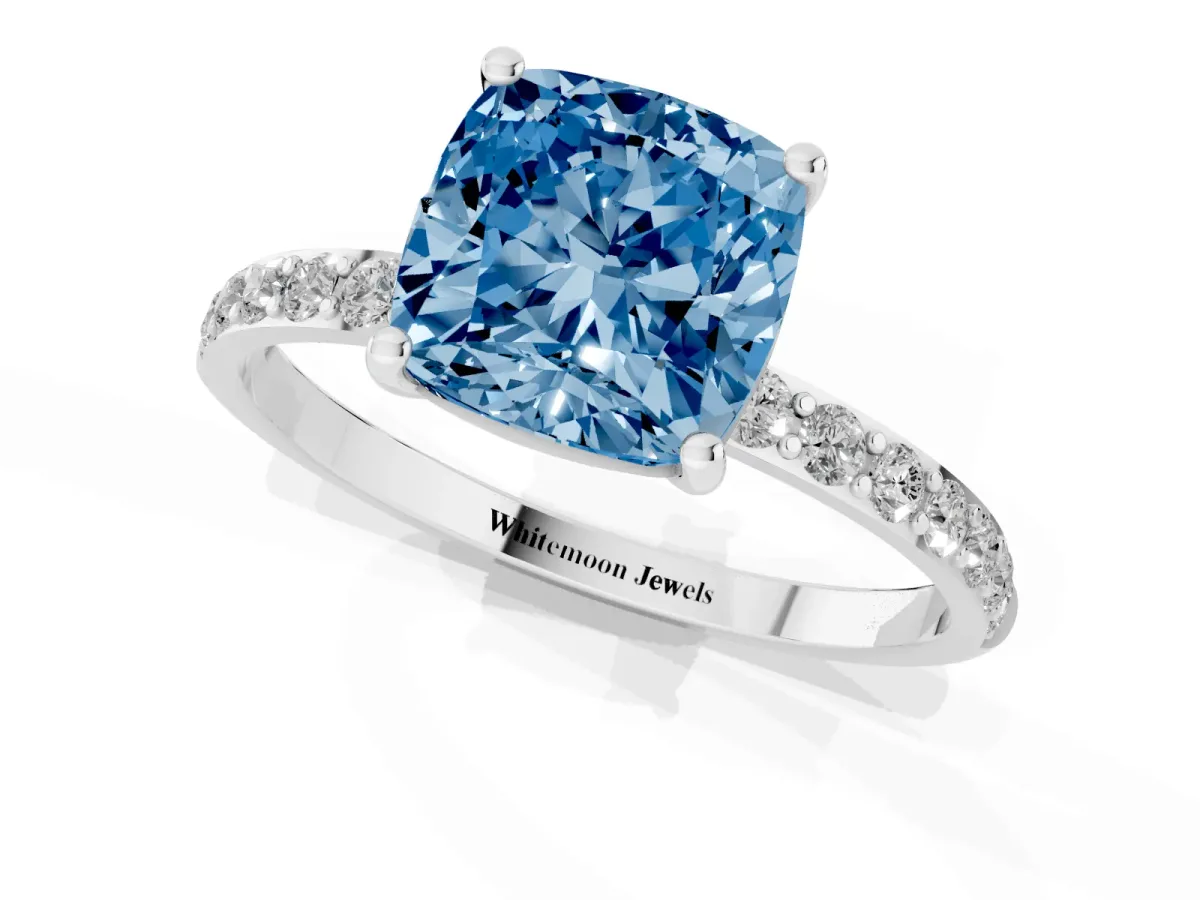 Fancy Blue Cushion Cut Diamond Solitaire Ring with Round Pavé Shoulders and Prong Setting Silver