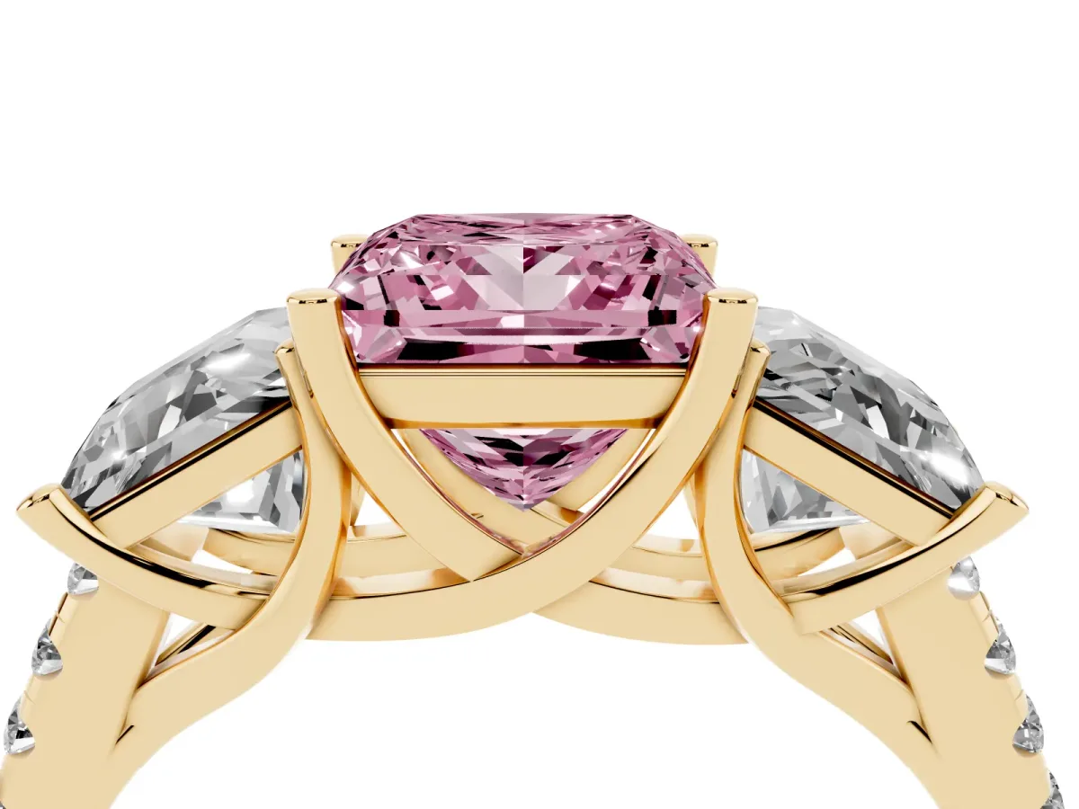 Fancy Pink Three-Stone Princess Cut Diamond Ring with Round Pavé Band and Prong Setting Yellow gold
