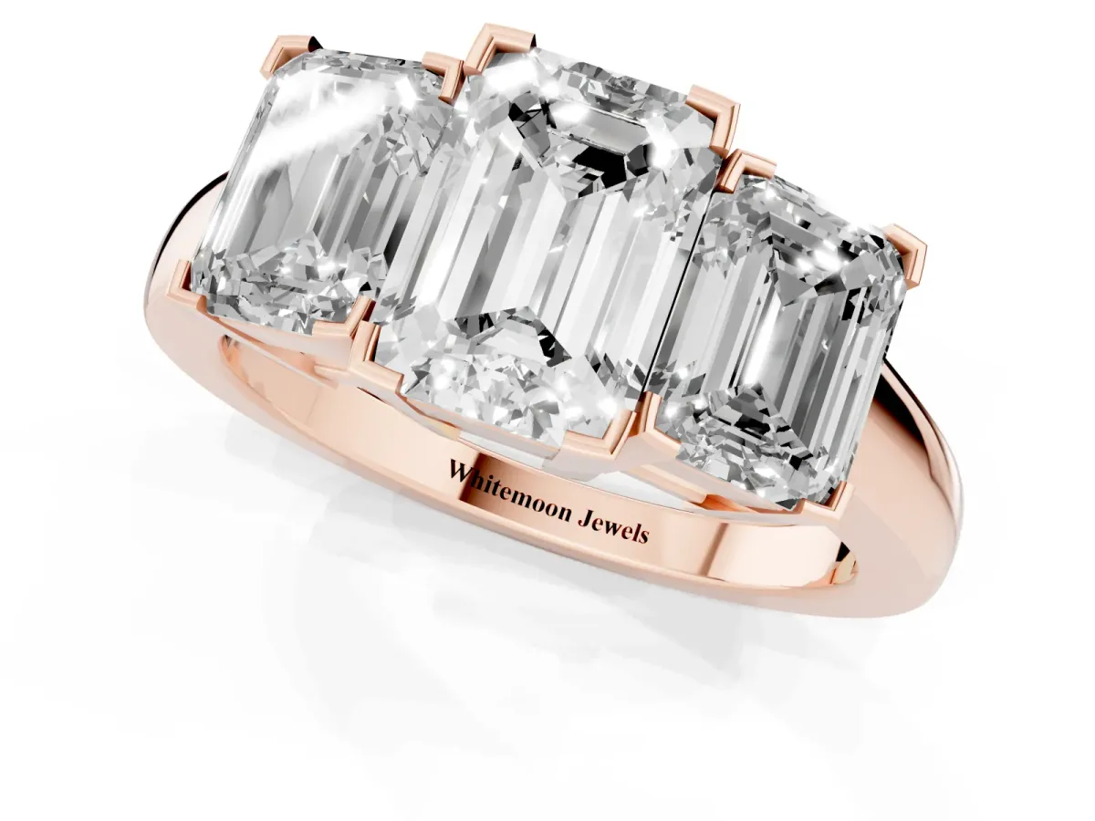 Three-Stone Emerald Cut Cut Diamond Ring with Channel Set Band and Four-Prong Setting Rose gold