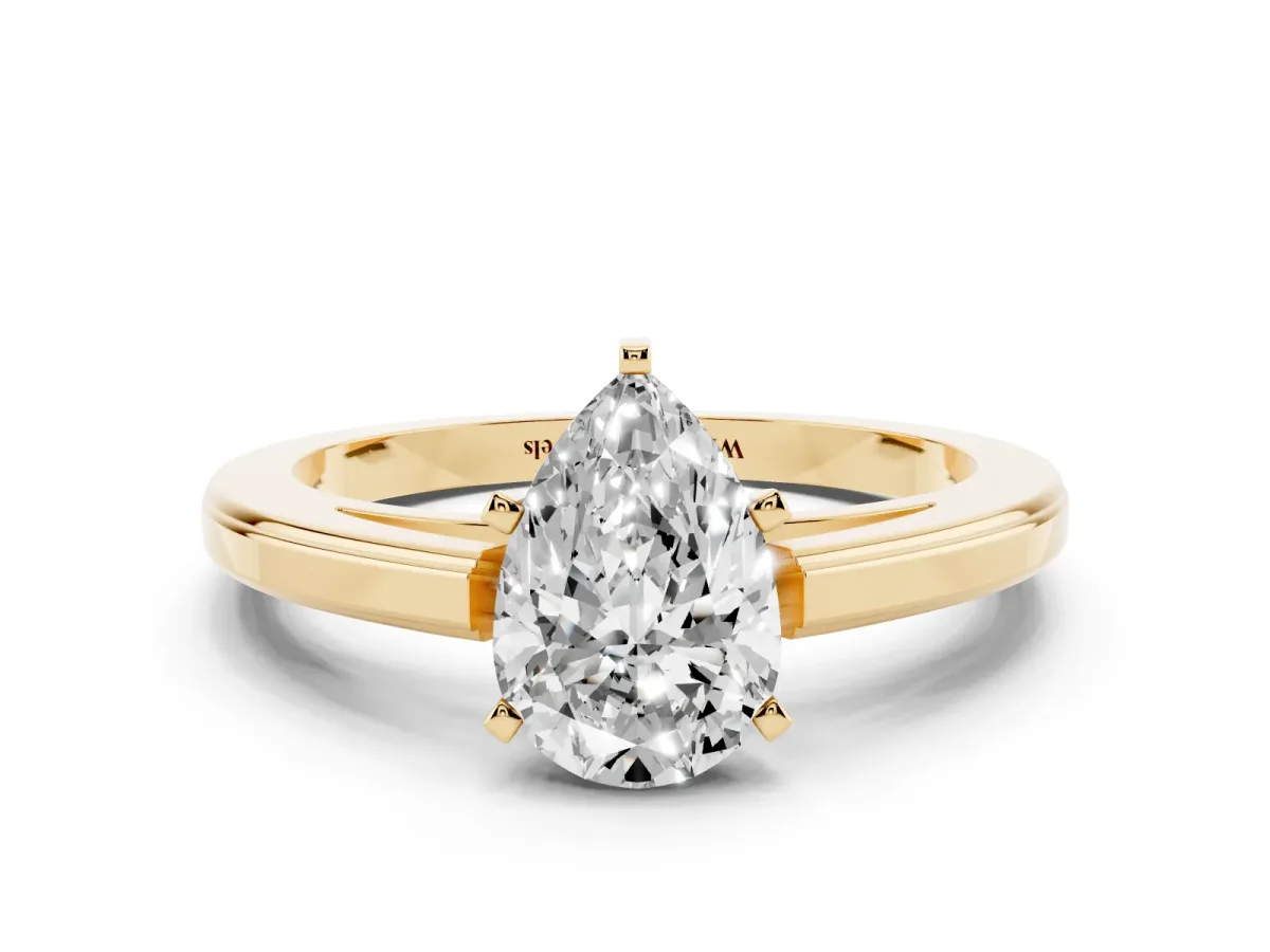 Pear Cut Solitaire Diamond Ring with Four-Prong Setting and Classic Band Yellow gold