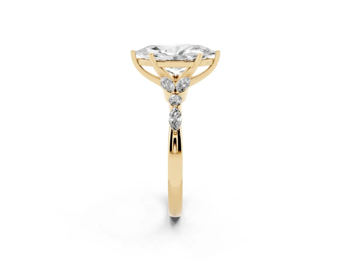 Marquise Cut Diamond Solitaire Ring with Side Stones and Four-Prong Setting Yellow gold