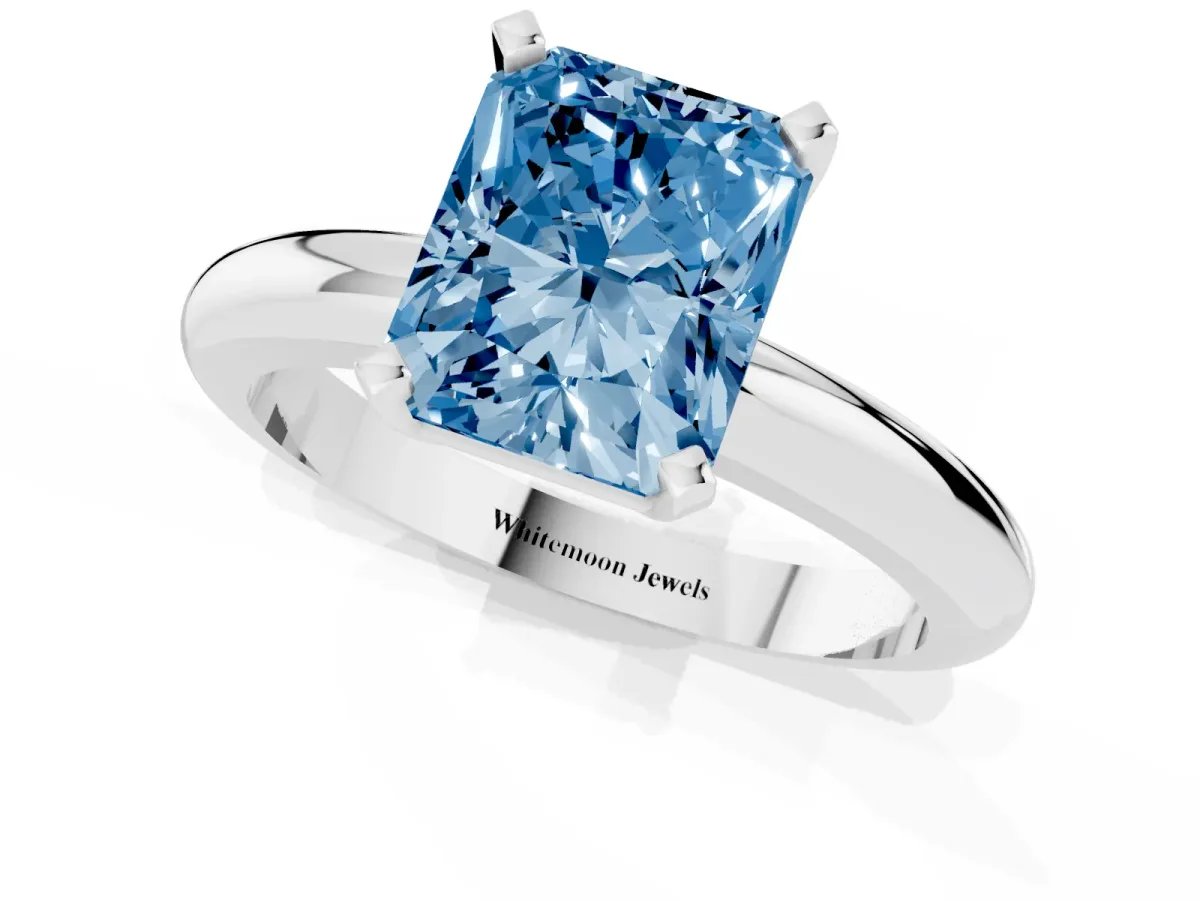 Fancy Blue Radiant Cut Diamond Solitaire Engagement Ring with Round Band and Four-Prong Setting Platinum
