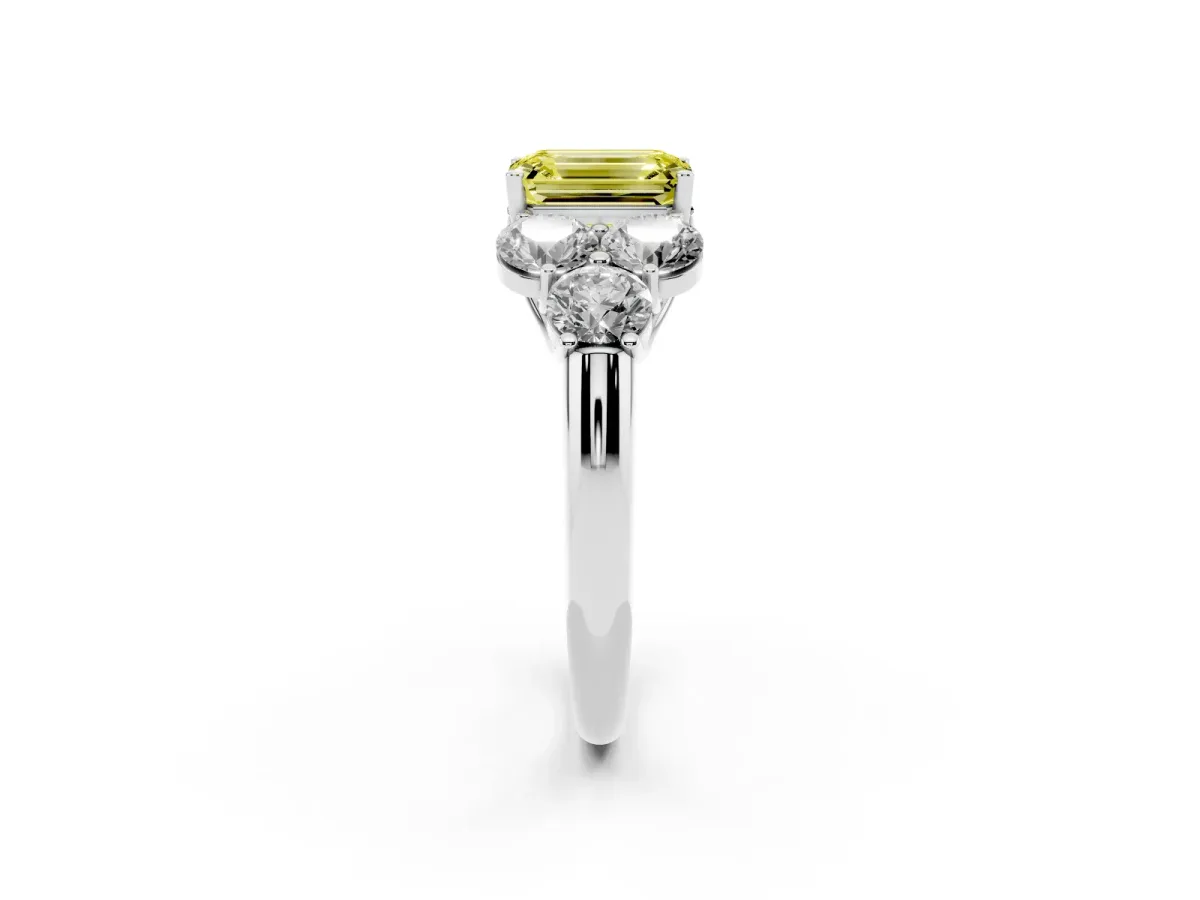 Fancy Yellow Emerald Cut Cut Diamond Cluster Ring with Round Accent Stones and Prong Setting on a Classic Band Silver