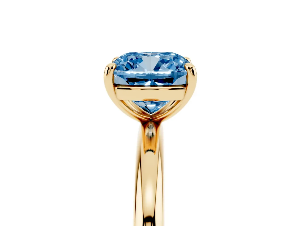 Fancy Blue Cushion Cut Solitaire Diamond Ring with Four-Prong Setting on a Plain Band Yellow gold