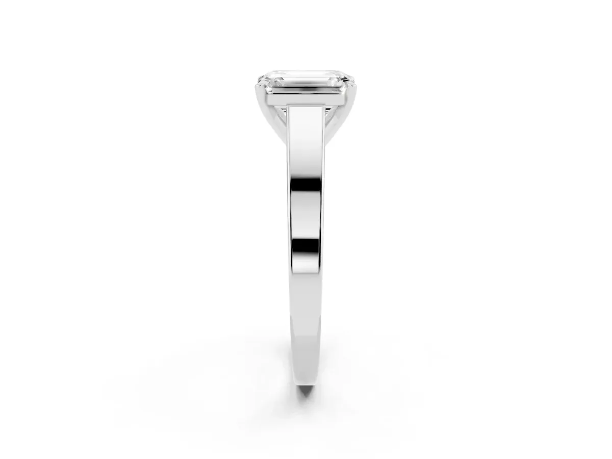 Emerald Cut Solitaire Engagement Ring with Four-Prong Setting and Tapered Band Silver
