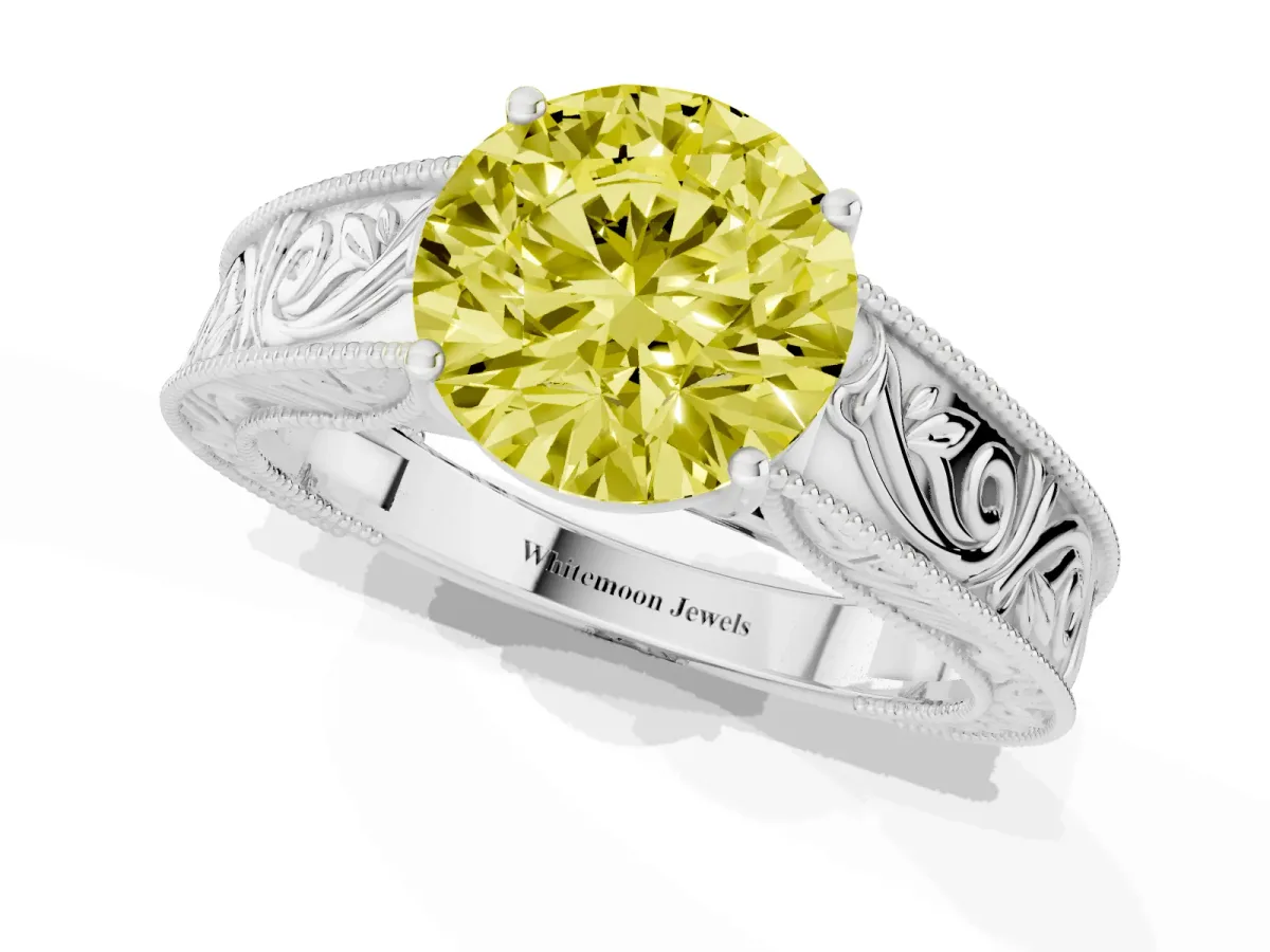 Fancy Yellow Round Cut Diamond Solitaire Ring with Engraved Band and Four-Prong Setting White gold