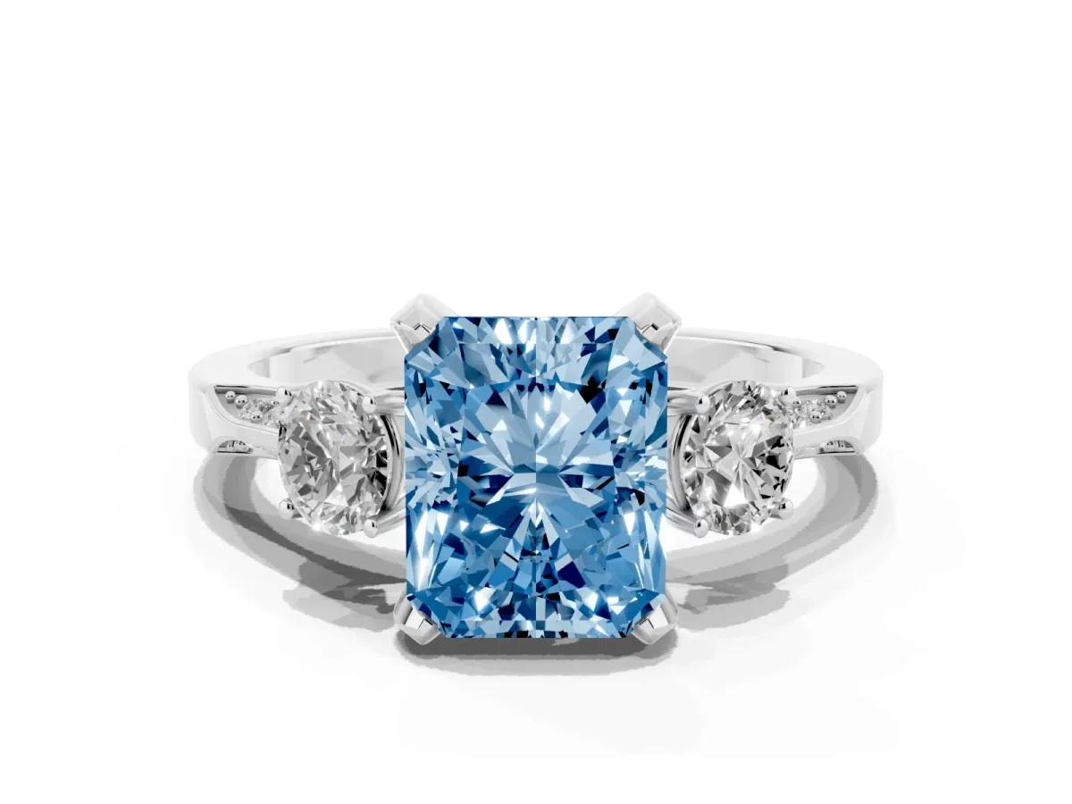 Fancy Blue Radiant Cut Brilliant Three-Stone Diamond Ring with Pavé Band and Four-Prong Setting Silver