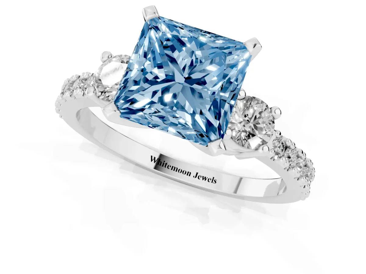 Fancy Blue Princess Cut Three-Stone Diamond Pavé Band with Prong Setting Silver