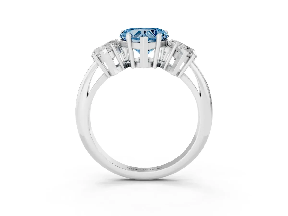 Fancy Blue Three-Stone Heart Cut Cut Diamond Engagement Ring with Prong Setting on a White Gold Band Platinum