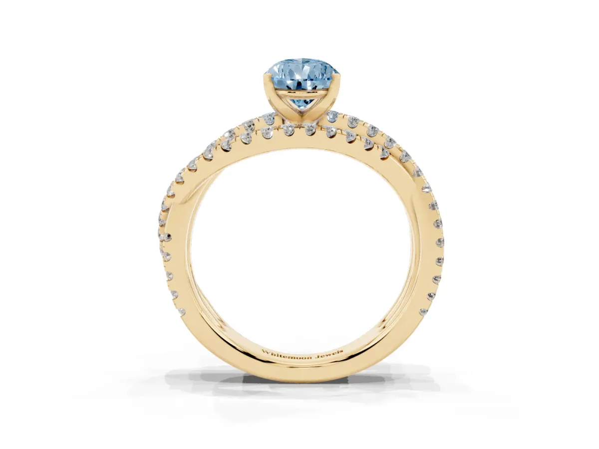 Fancy Blue Pear Cut Solitaire Twist Band with Pavé Setting and Four-Prong Setting Yellow gold