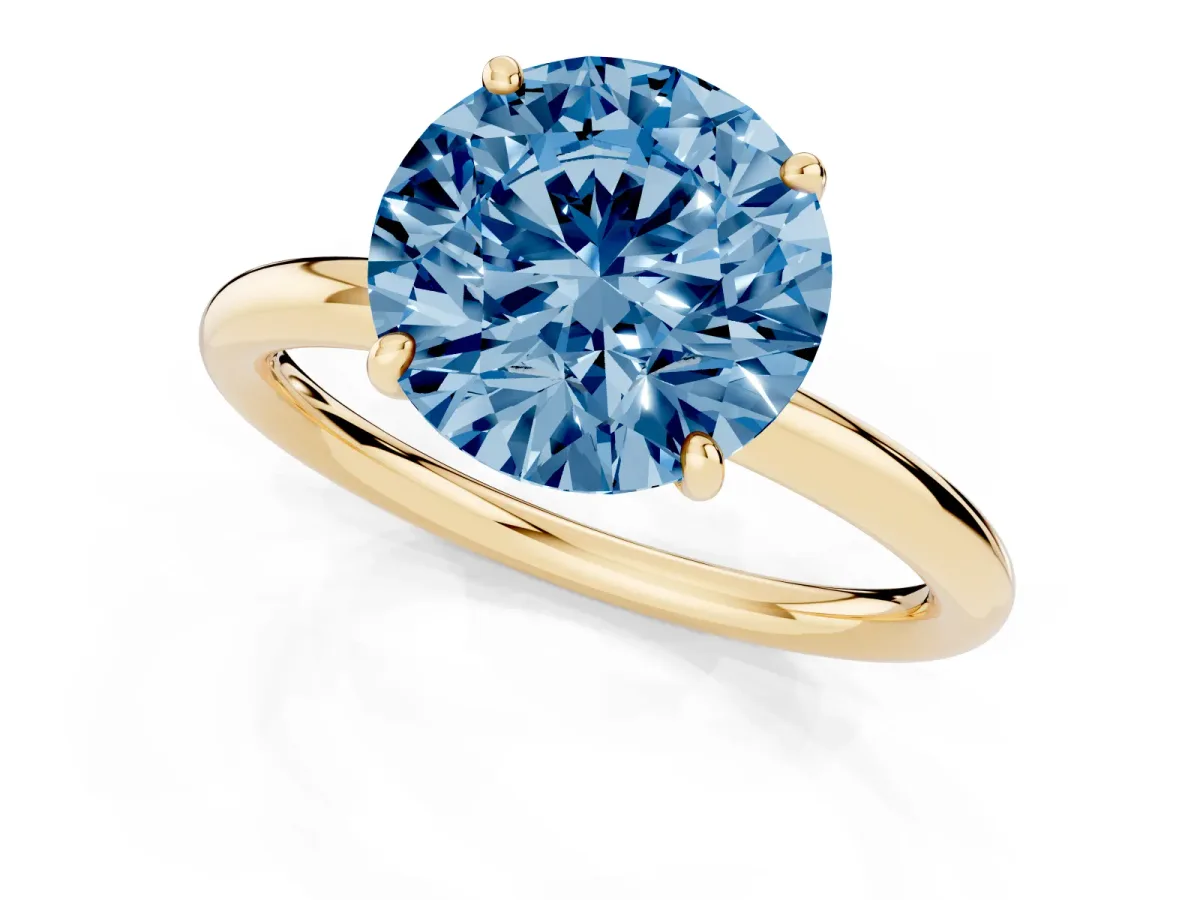 Fancy Blue Round Cut Solitaire Diamond Ring with Four-Prong Setting on a Plain Band Yellow gold