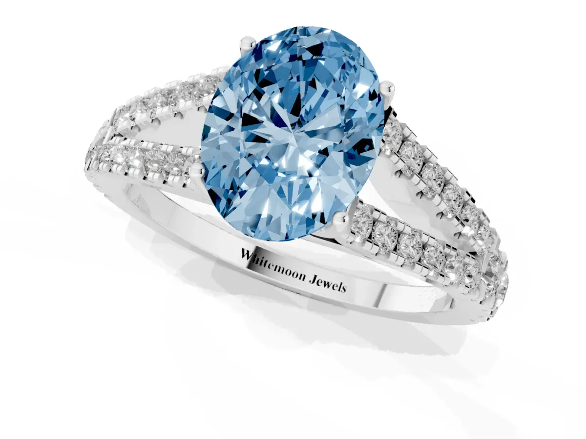 Fancy Blue Oval Cut Diamond Split Shank Engagement Ring with Round Pavé and Prong Setting Silver