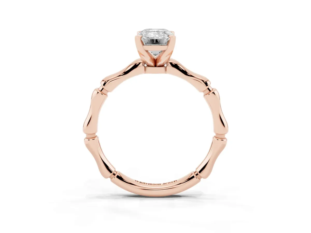 Emerald Cut Solitaire Diamond Ring with Bamboo Band and Four-Prong Setting Rose gold