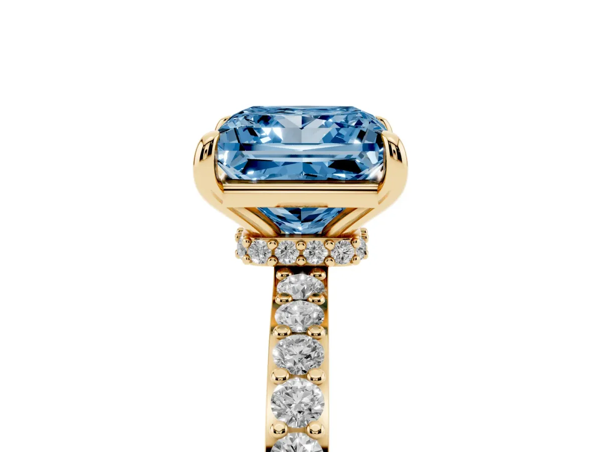 Fancy Blue Princess Cut Diamond Solitaire Engagement Ring with Pavé Band and Four-Prong Setting Yellow gold