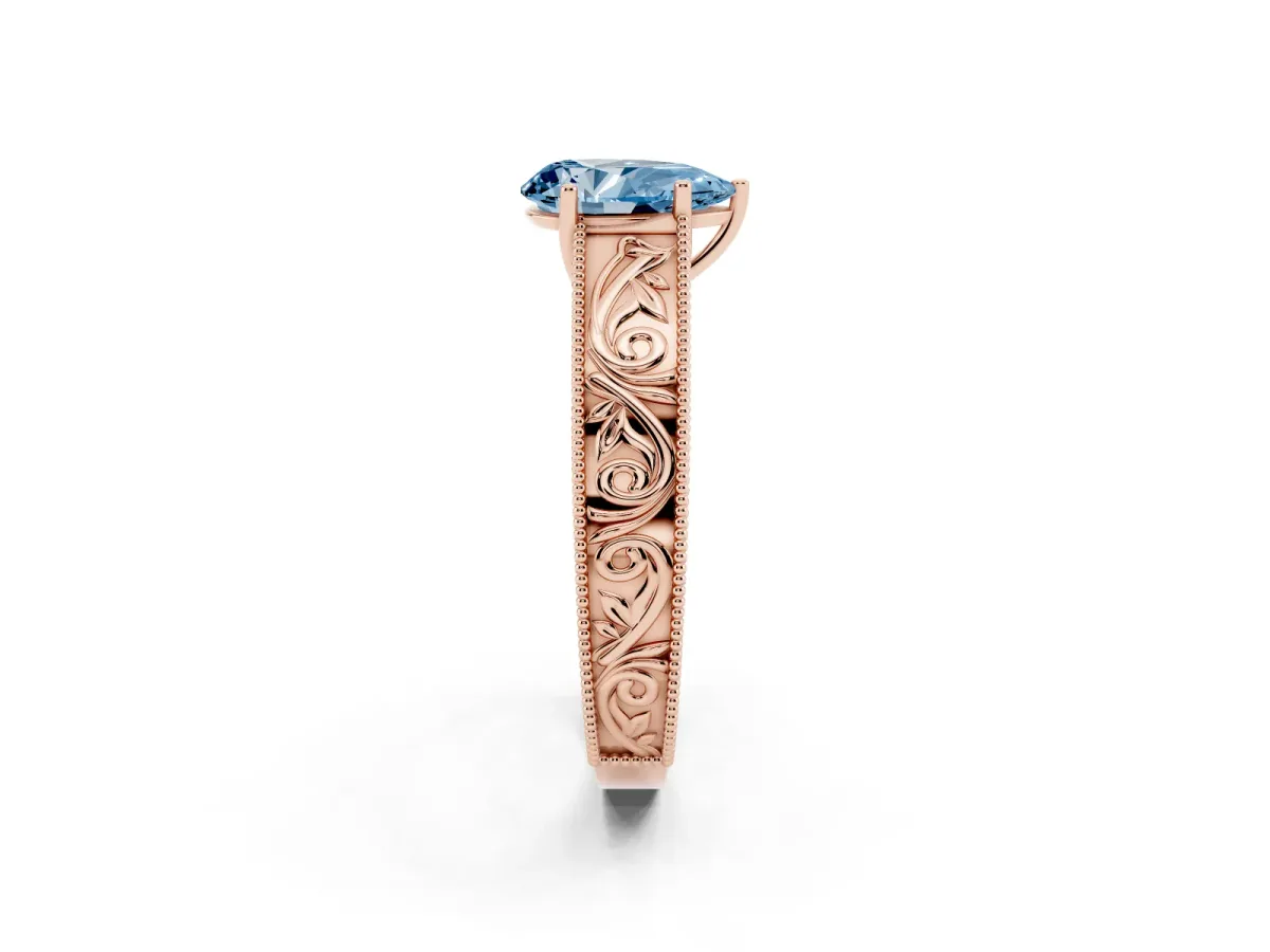 Fancy Blue Pear Cut Diamond Solitaire Ring with Engraved Band and Four-Prong Setting Rose gold