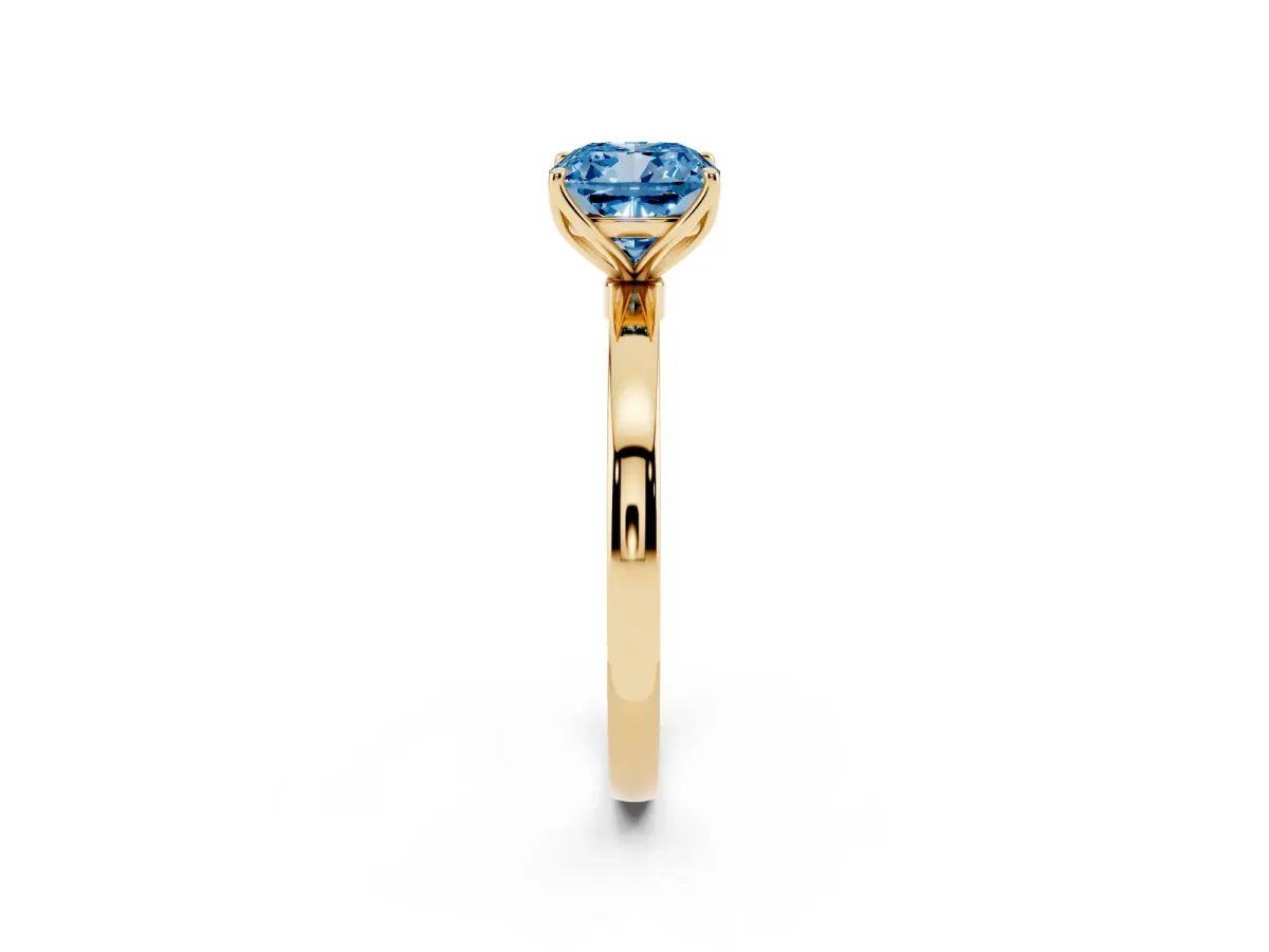 Fancy Blue Cushion Cut Diamond Solitaire Ring with Thin Band and Prong Setting Yellow gold