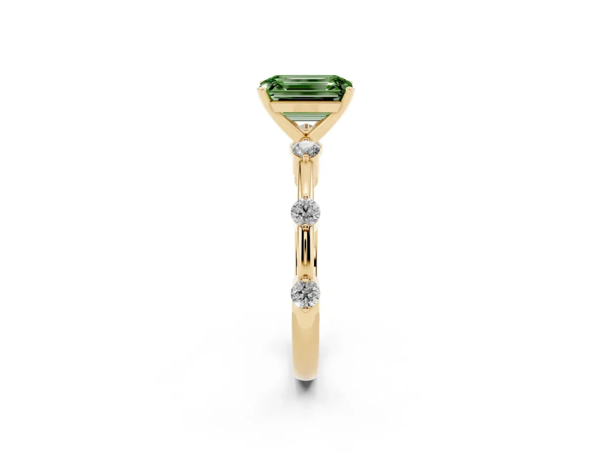 Fancy Green Emerald Cut Solitaire Diamond Ring with Bezel Set Side Stones and Prong Setting Yellow gold