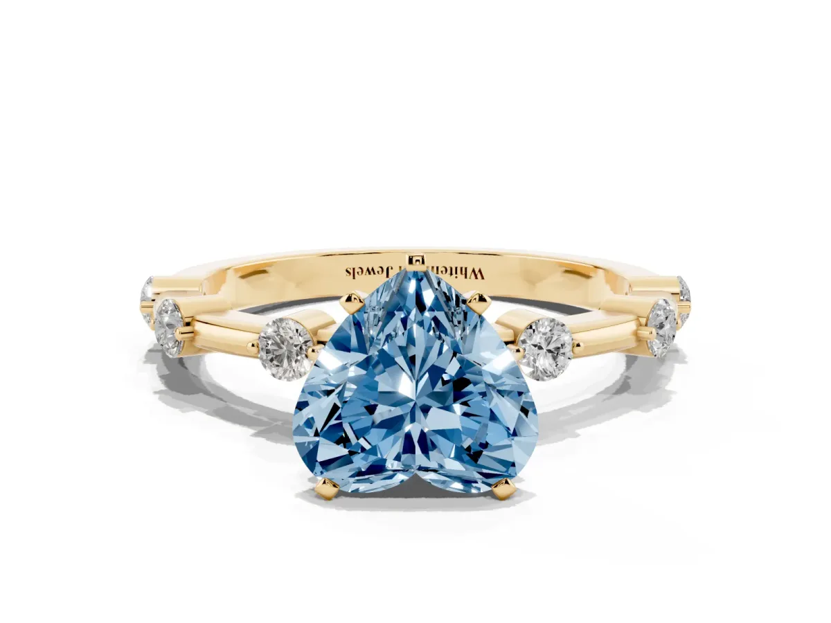 Fancy Blue Heart Cut Solitaire Diamond Ring with Bezel Set Side Stones and Prong Setting Yellow gold