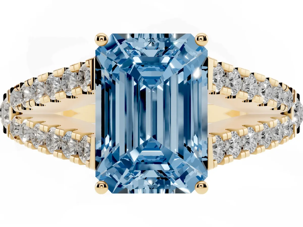 Fancy Blue Emerald Cut Diamond Split Shank Engagement Ring with Round Pavé and Prong Setting Yellow gold