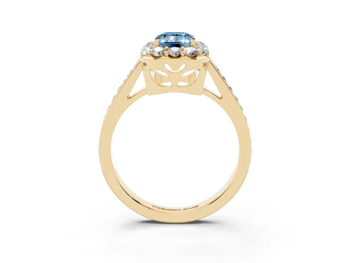Fancy Blue Emerald Cut Diamond Floral Halo Ring with Pavé Band and Prong Setting Yellow gold