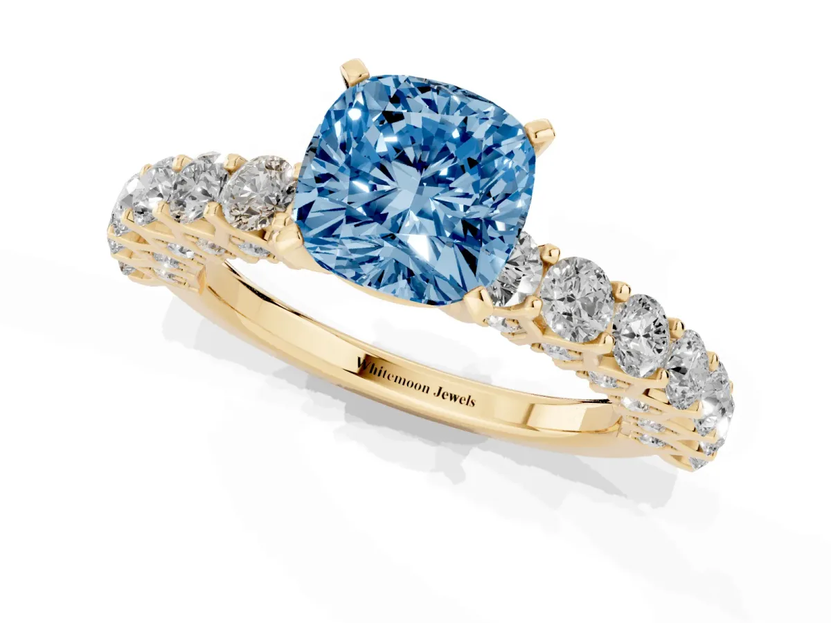 Fancy Blue Cushion Cut Diamond Solitaire Ring with Shared Prong Pavé Band and Four-Prong Setting Yellow gold