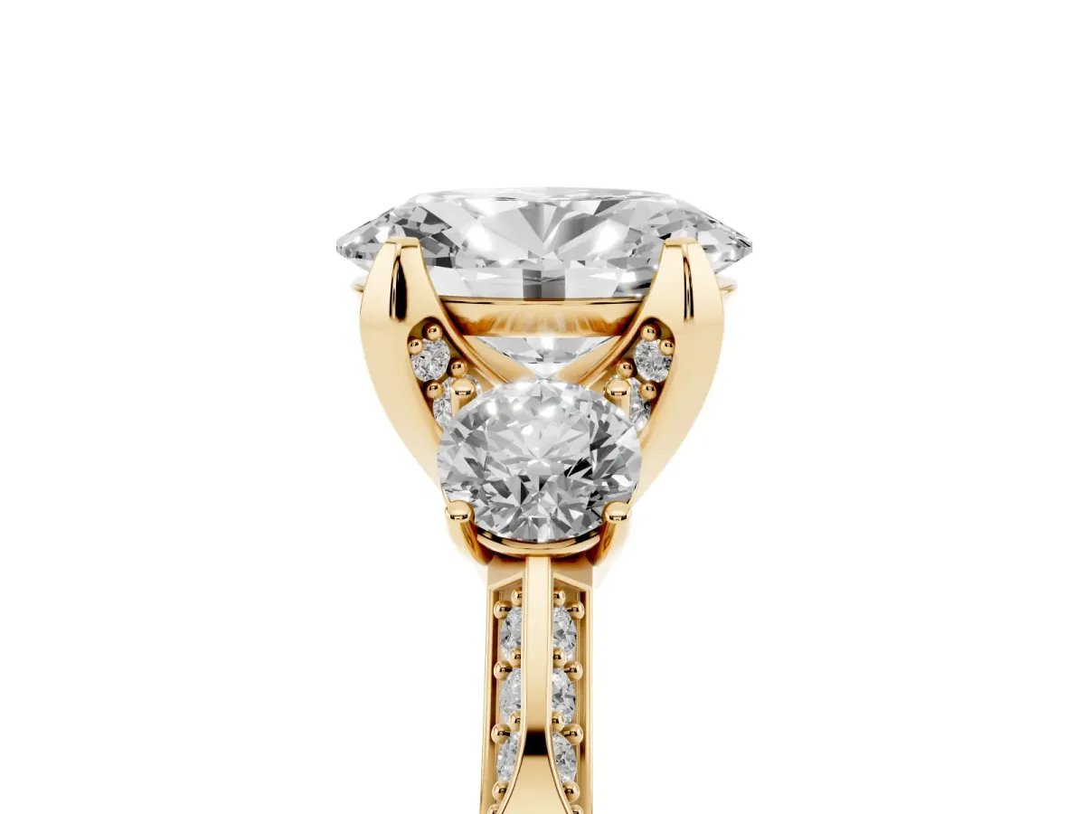 Oval Cut Brilliant Three-Stone Diamond Ring with Pavé Band and Four-Prong Setting Yellow gold