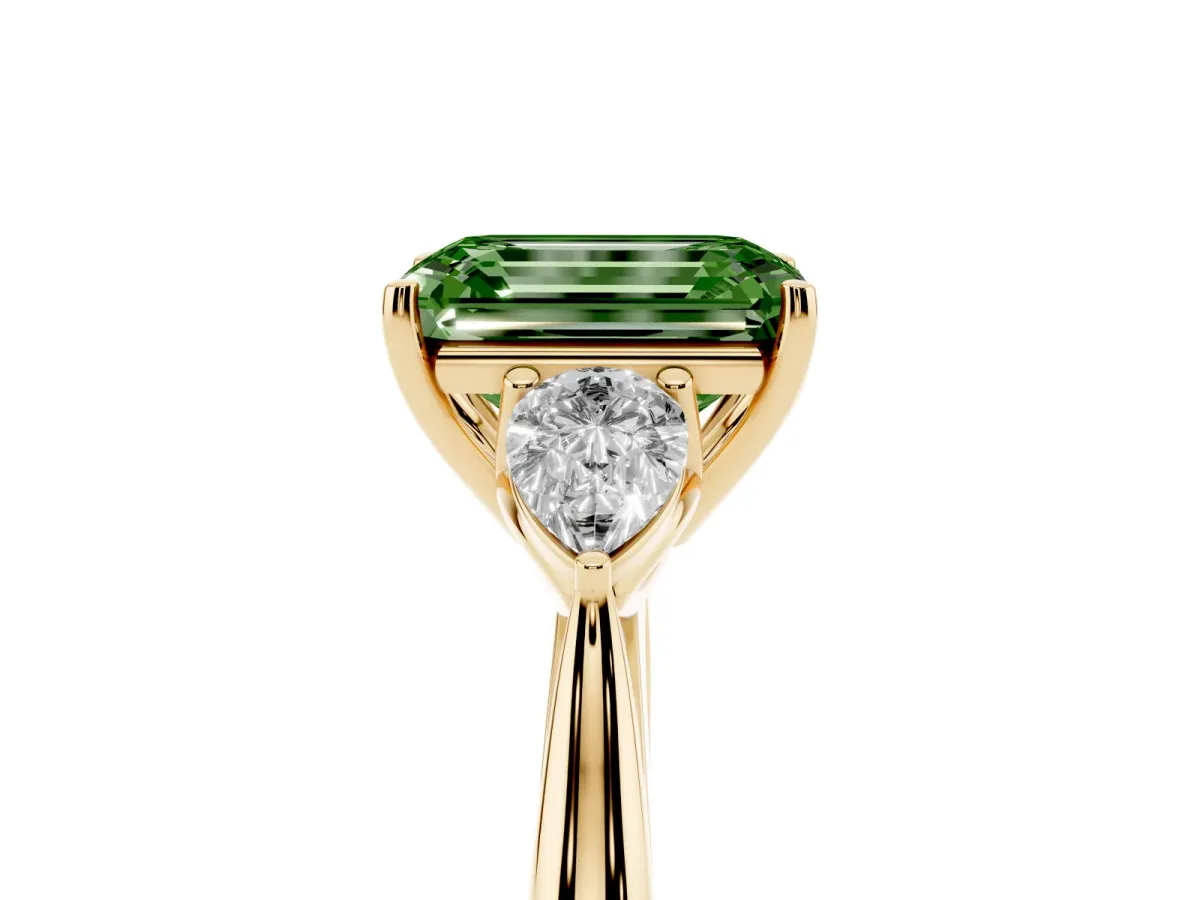 Fancy Green Emerald Cut Diamond Three-Stone Ring with Pear Side Stones and Prong Setting Yellow gold