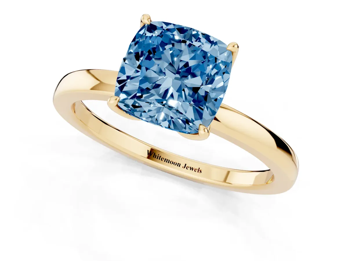 Fancy Blue Cushion Cut Diamond Solitaire Ring with Thin Band and Prong Setting Yellow gold