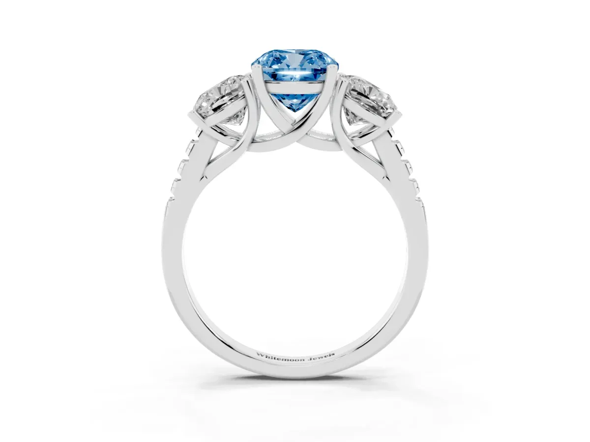 Fancy Blue Three-Stone Cushion Cut Diamond Ring with Round Pavé Band and Prong Setting Silver