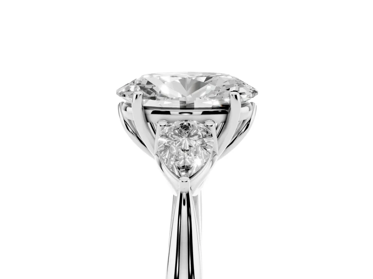 Three-Stone Oval Cut Diamond Ring with Pear Side Stones in Four-Prong Setting Platinum
