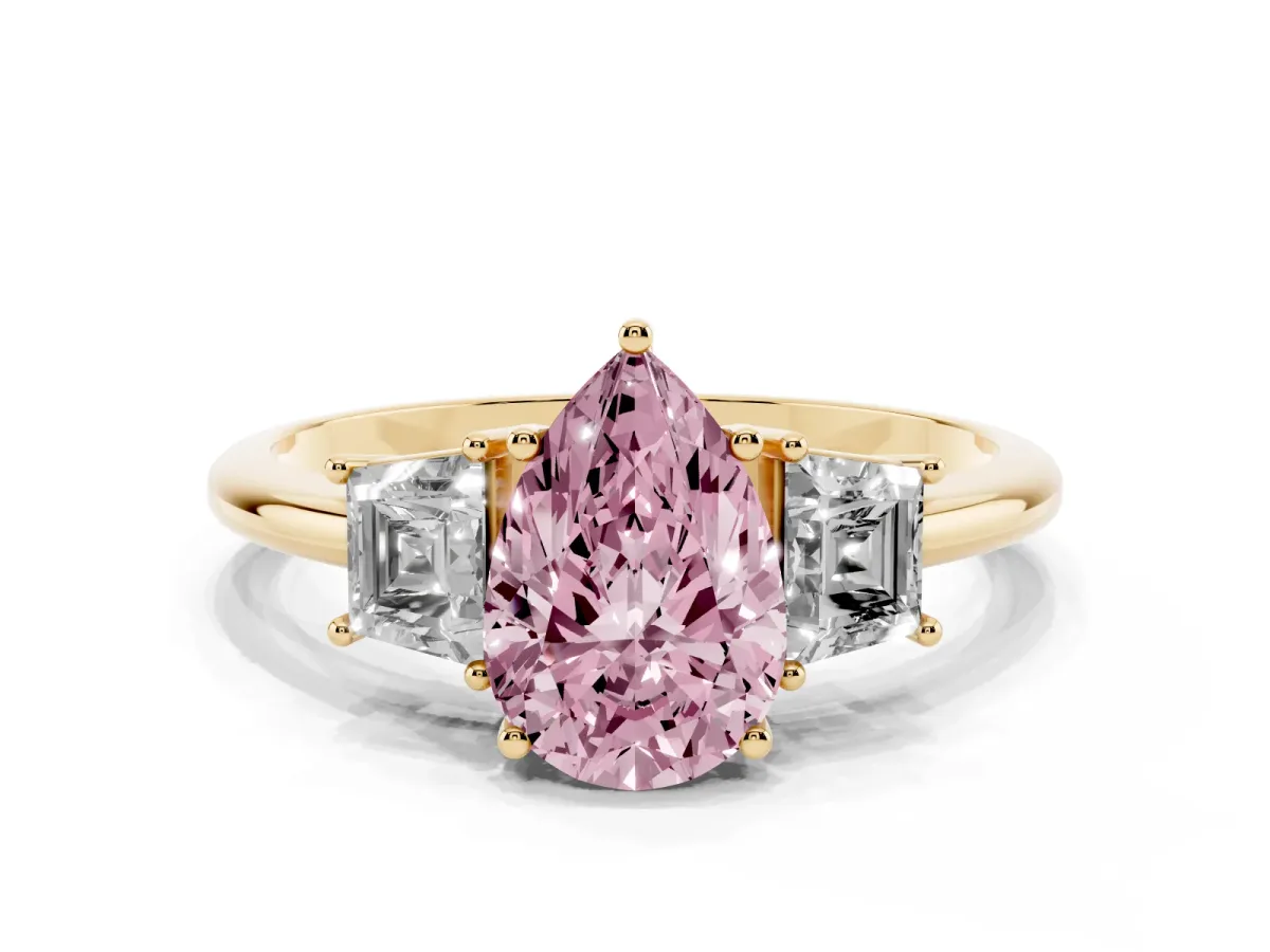 Fancy Pink Pear Cut Diamond Three-Stone Ring with Trapezoid Side Stones and Prong Setting Yellow gold
