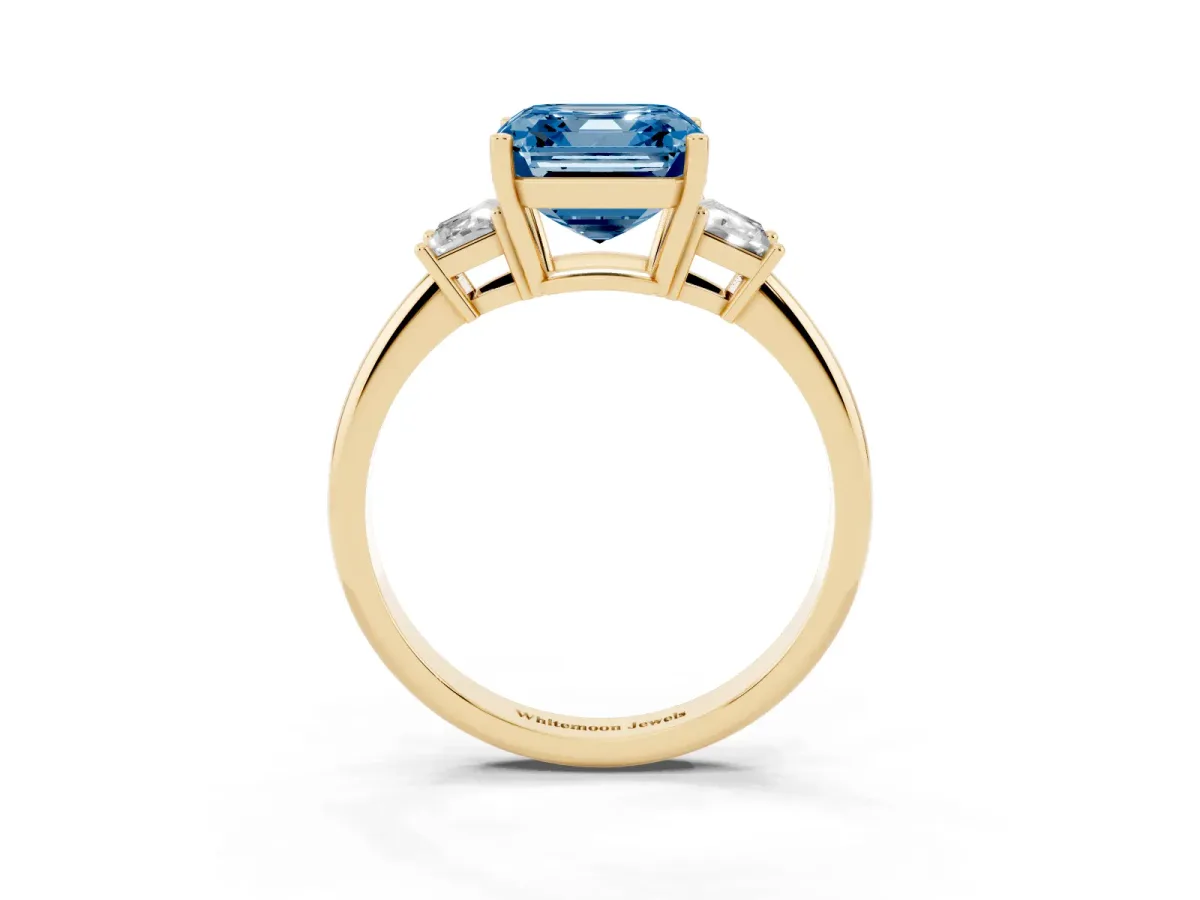 Fancy Blue Asscher Cut Diamond Three-Stone Ring with Trapezoid Side Stones and Prong Setting Yellow gold