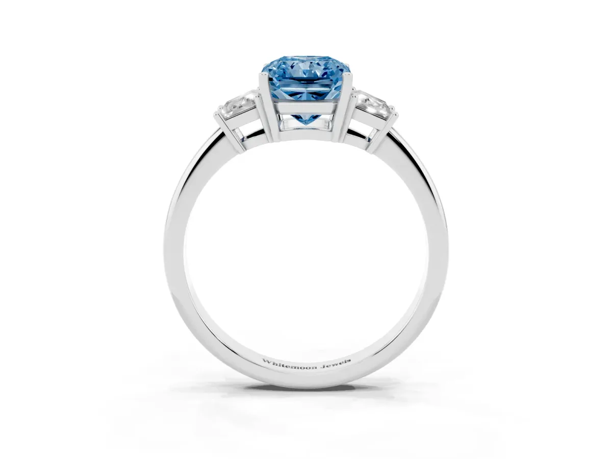 Fancy Blue Radiant Cut Diamond Three-Stone Ring with Trapezoid Side Stones and Prong Setting Silver